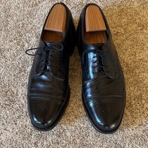 Allen Edmonds black leather cap toe Lexington oxfords.